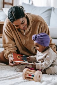 mother-and-infant-reading-book-together