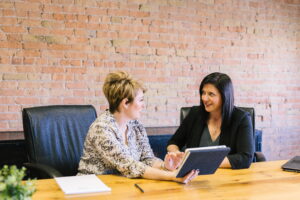 a speech language pathologist conducts an assessment of a person with aphasia