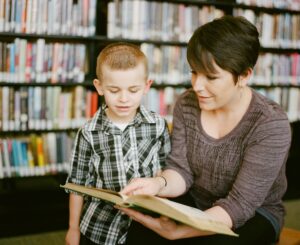 a speech therapist works with an elementary school student